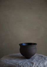 Charcoal and black chawan