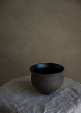 Charcoal and black chawan